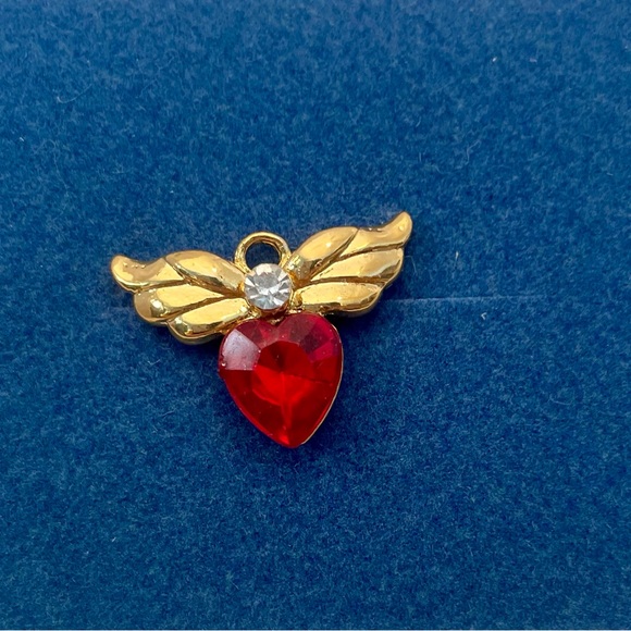Avon Jewelry - Vintage Avon May Birthstone Red Lapel Pin with Gold Metal Wings Clear Halo GUC